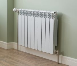 Heating Radiator, White radiator in an apartment.